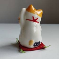 Gatto Manekineko zampa sinistra